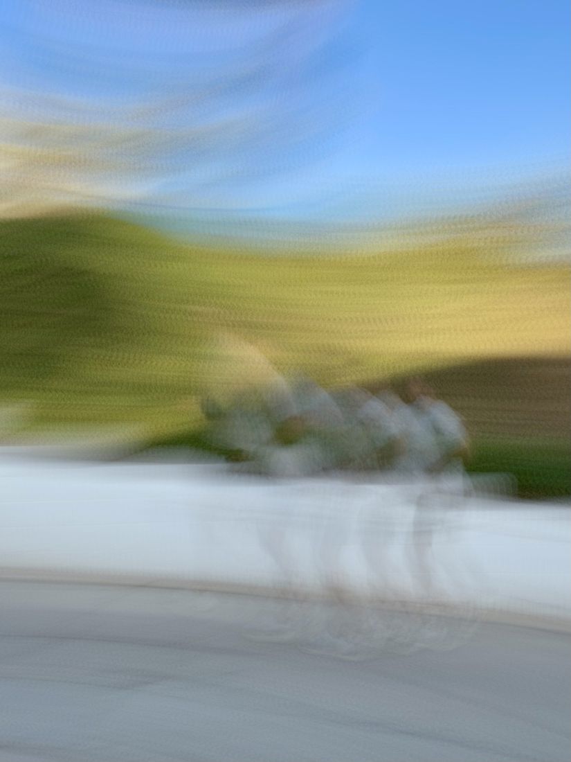 Two runners on a sunny path, softly blurred in motion